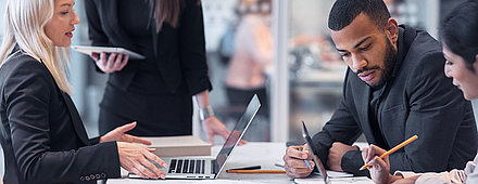 Productive office crisis session by male-female IT group to troubleshoot network problems