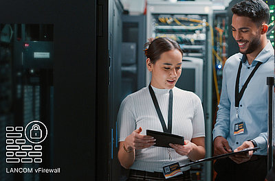 Two employees are standing in a server room, next to them is the icon of the LANCOM vFirewall