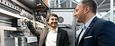 Markus Irle, Vice President Firewall and Security with IT colleagues in firewall server room