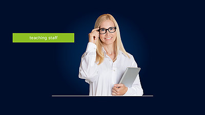 Engaged blonde teacher with long hair, glasses and tablet in hand on dark blue background with light green lettering "Teaching staff"