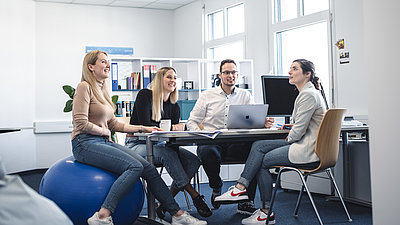 Trainees exchange ideas in a round of talks