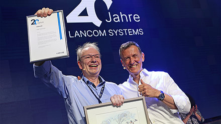 Founder Ralf Koenzen and co-managing director Uwe Neumeier celebrate 20 years of LANCOM System GmbH