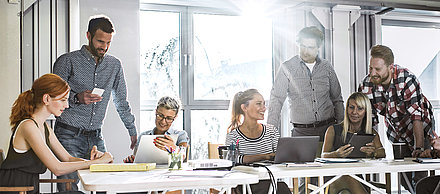 People discussing at a desk