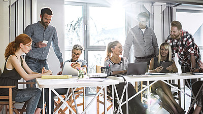 People discussing at a desk