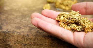 Gold in one hand