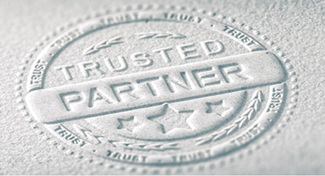 Image of a stamp imprint with the inscription Trusted Partner
